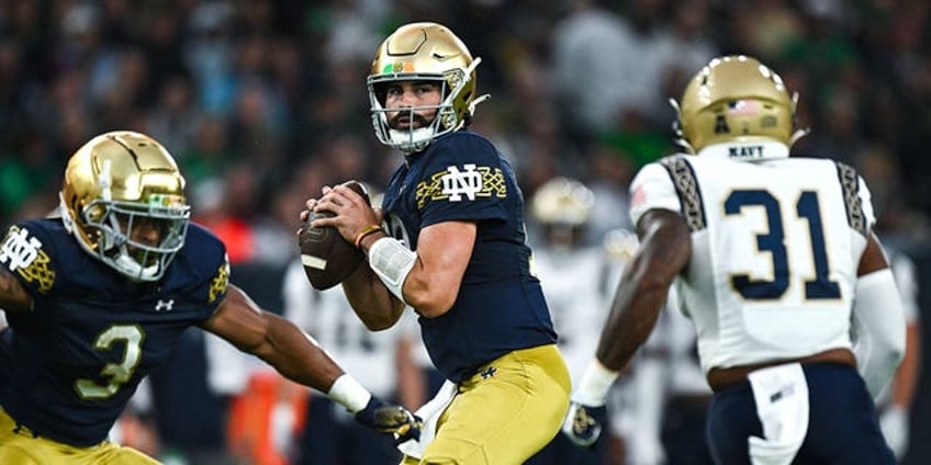 notre dame showcases sam hartmans rib necklace before opening game vs navy