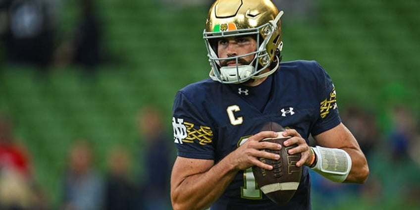 notre dame showcases sam hartmans rib necklace before opening game vs navy