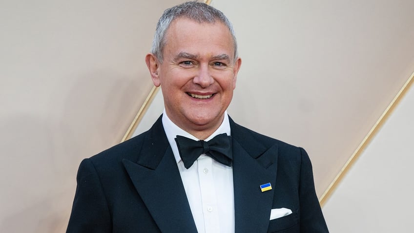 Hugh Bonneville in a tuxedo at the premiere of "Downton Abbey: A New Era."