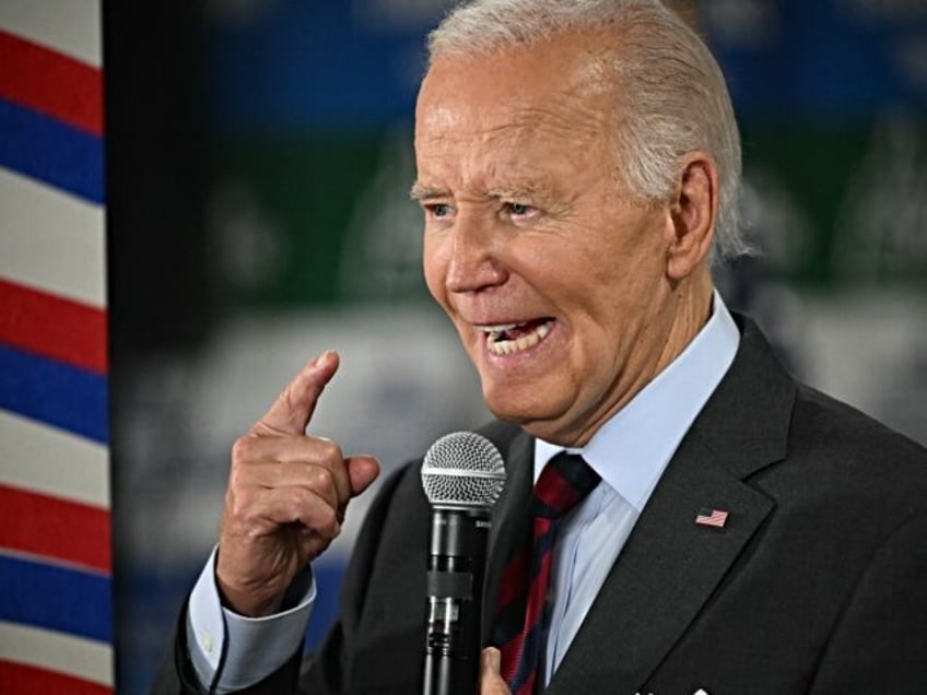 US President Joe Biden speaks to staff as he visits a New Hampshire Democratic coordinated