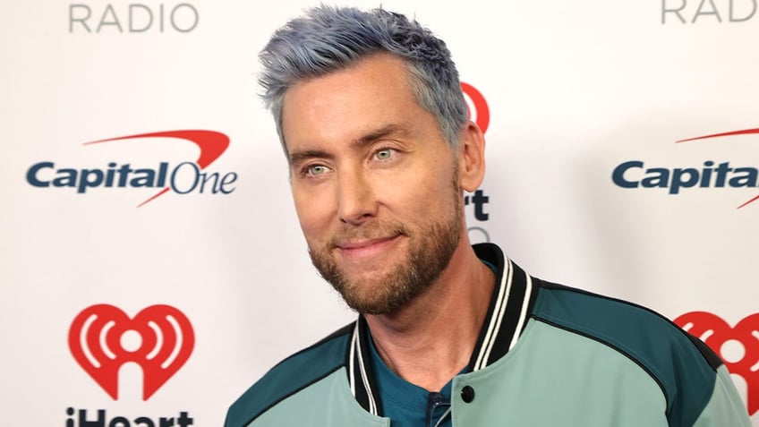 nsyncs lance bass has three word message for cameras searching for nfls hottest couple