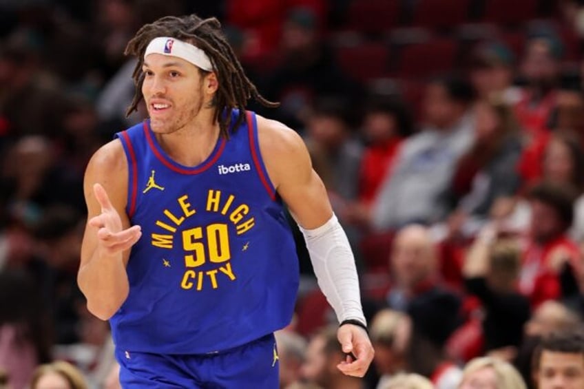 Aaron Gordon of the Denver Nuggets celebrates a three-pointer in an NBA game against the Chicago Bulls