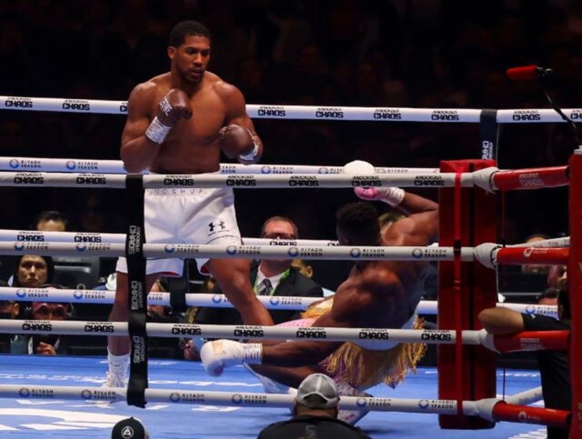 Down and almost out: Anthony Joshua sends Francis Ngannou to the canvas