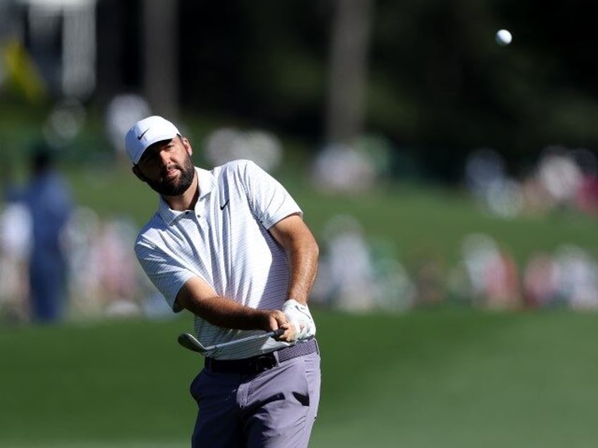 Scottie Scheffler plays his shot on the eighth hole during the third round of the 2024 Mas