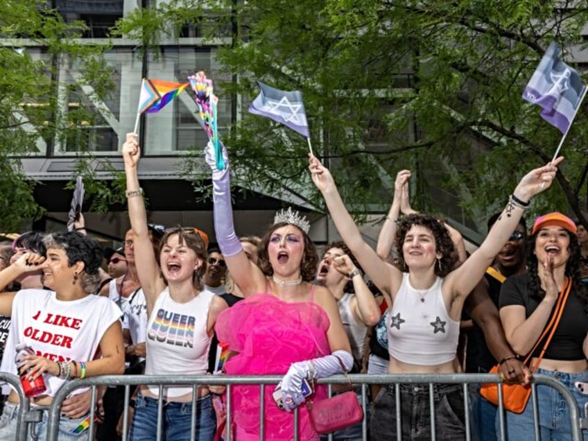 NEW YORK, NY - JUNE 30: New Yorkers celebrate during the annual Pride March into the West