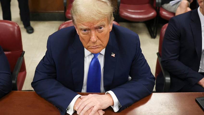 Donald Trump sitting in Manhattan courtroom