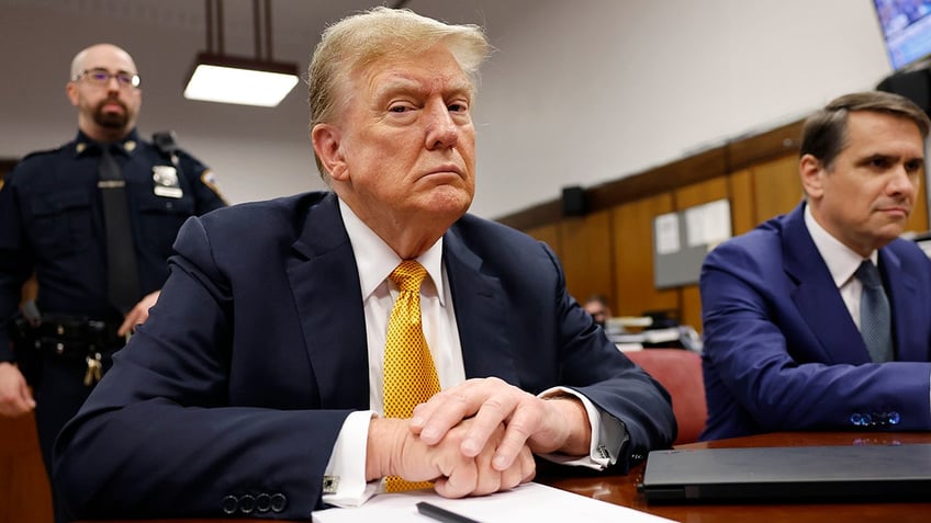 Donald Trump sits in the courtroom during his hush money trial at Manhattan Criminal Court