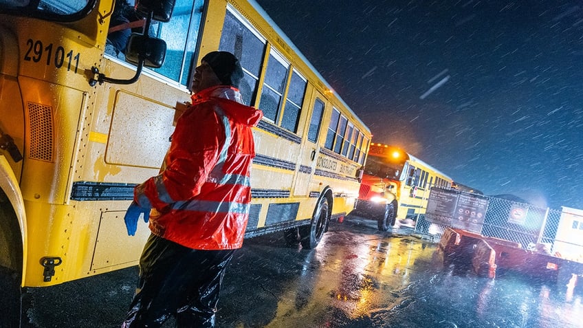 Work man next to school bus