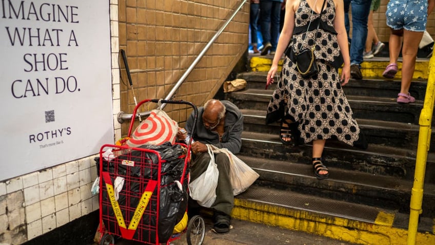 NYC homeless blocks subway entrance