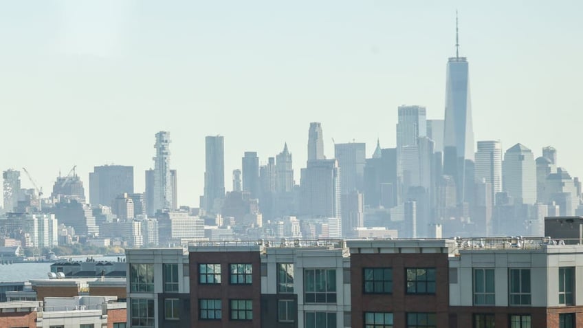 Jersey City in foreground with manhatten skyline in the background