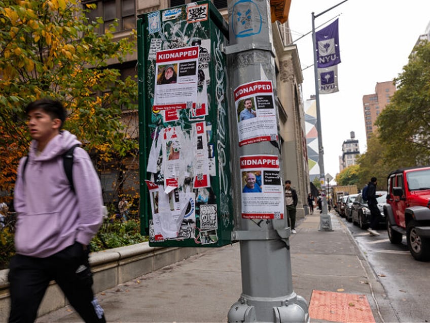 NEW YORK, NEW YORK - OCTOBER 30: Posters of some of those kidnapped by Hamas in Israeli ar