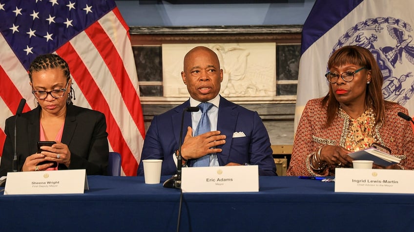 New York City Mayor Eric Adams is flanked by his Deputy Mayor Sheena Wright, left, and adviser Ingrid Lewis-Martin, during his weekly in-person news conference at City Hall Blue Room on March 5, 2024, in New York. 