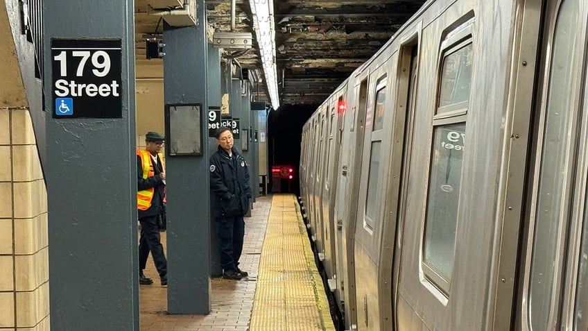 Police at scene of woman dead on subway