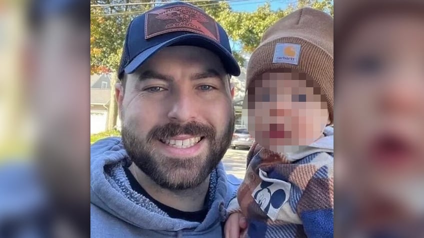 NYPD Officer Jonathan Diller poses with son