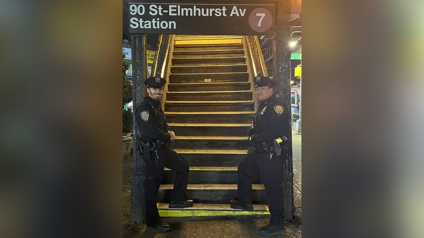 nypd officers save straphanger who fell onto subway tracks in queens