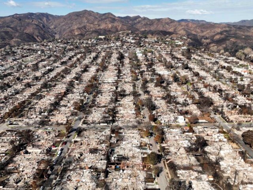 FILE - The devastation from the Palisades Fire is visible in the Pacific Palisades neighbo