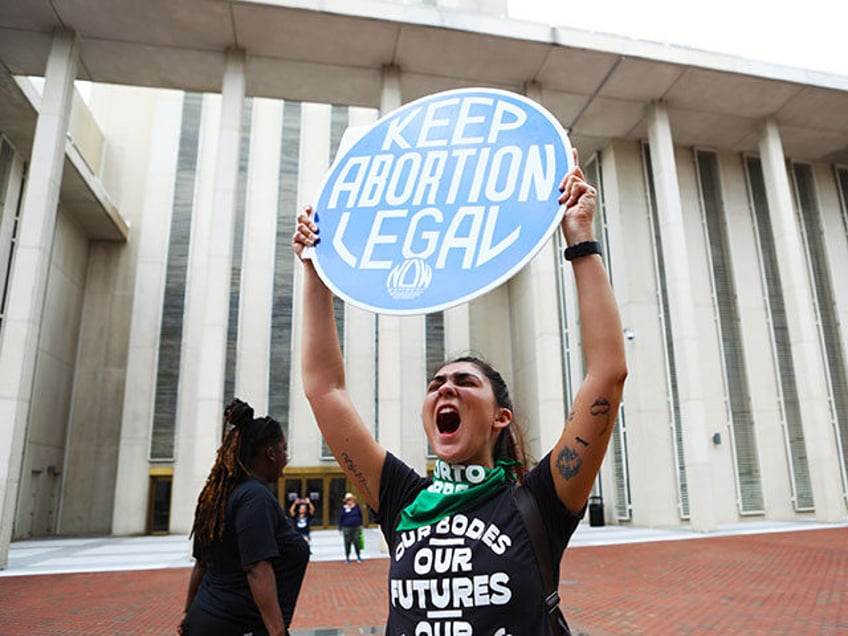 Faith Halstead, chants along with other protesters and activists near the Florida State Ca