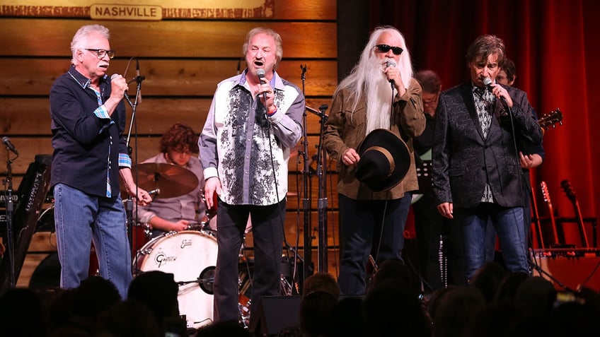 Oak Ridge Boys Joe Bonsall, Duane Allen, William Lee Golden and Richard Sterban perform on stage (all standing) in Nashville