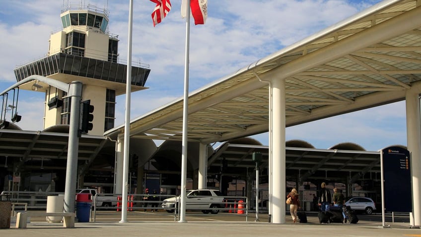 Travelers prepare to enter Oakland International airport