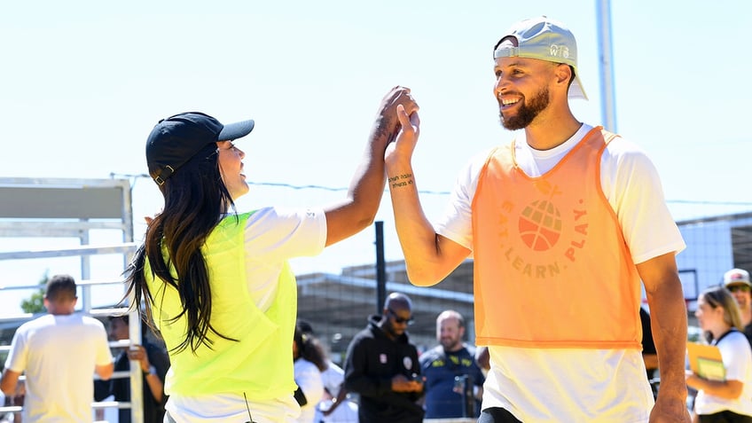 Ayesha and Steph high-five