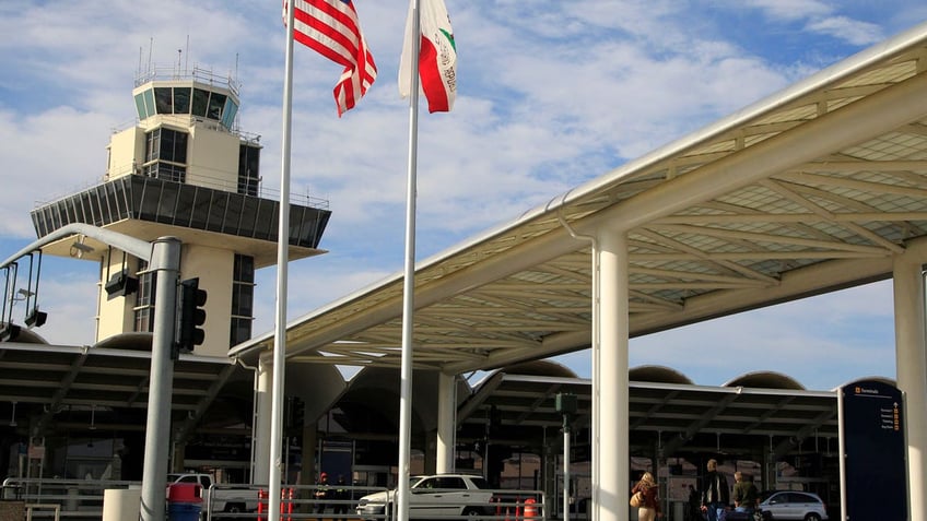 Travelers prepare to enter Oakland International airport