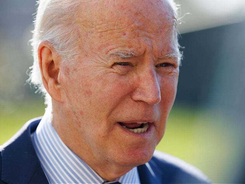 US President Joe Biden is speaking to the press on the South Lawn of the White House in Wa