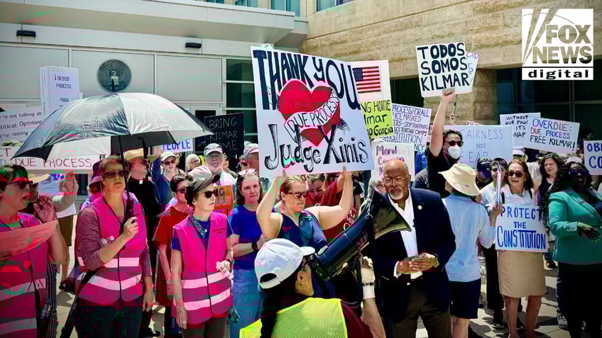 People pictured at a protest demanding Kilmar Abrego Garcia's return to the U.S.