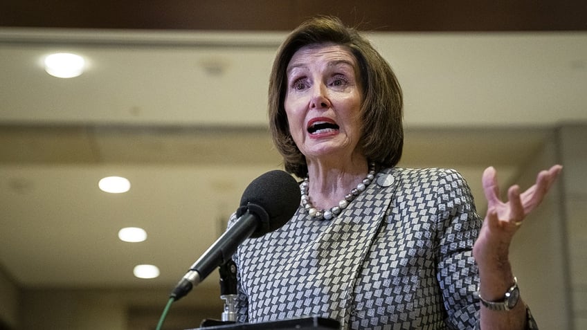 Nancy Pelosi speaks at a podium