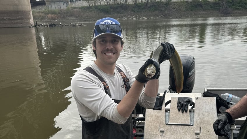 Liam Odell with eel in KS river