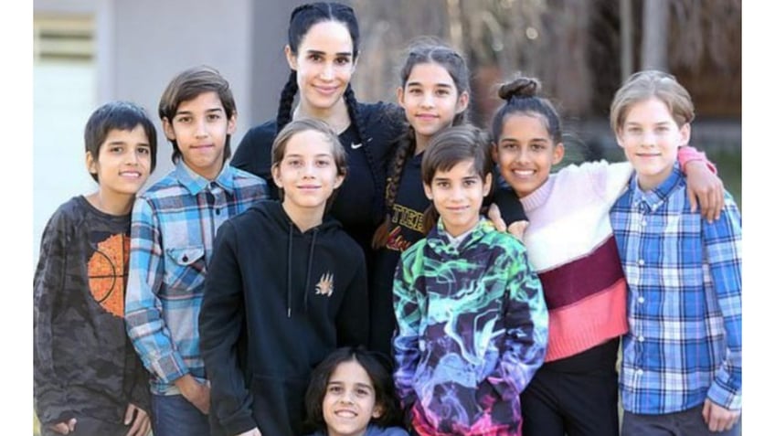 Nadya Suleman, known as 'Octomom' poses with her octuplets in a family photo