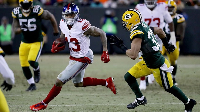 Odell Beckham runs with the football after a catch