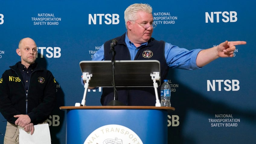 National Transportation Safety Board member Todd Inman speaks with reporters at Ronald Reagan Washington National Airport, Saturday, in Arlington, Va.