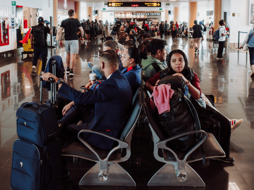 People Waiting in Departure Gate Waiting Area Airport