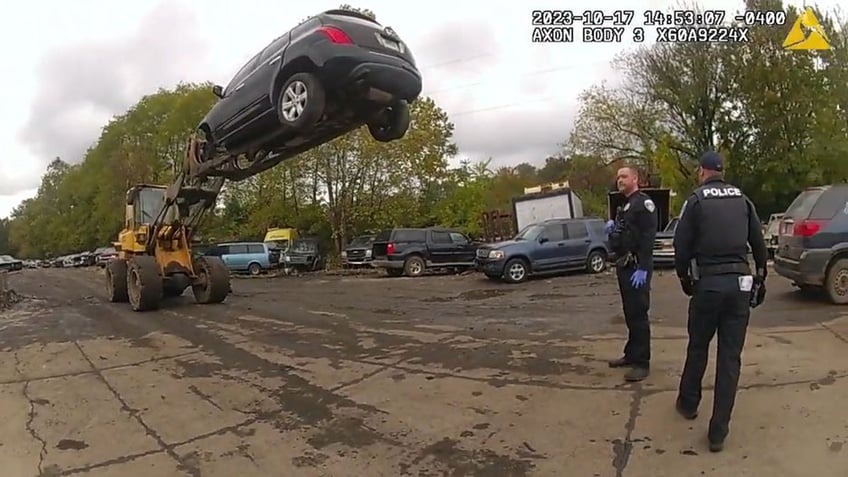 ohio car theft suspect foiled by quick thinking forklift operator who holds him 20 feet in the air