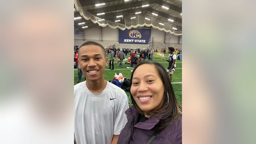 James and Tamia Woods pictured together at a track event