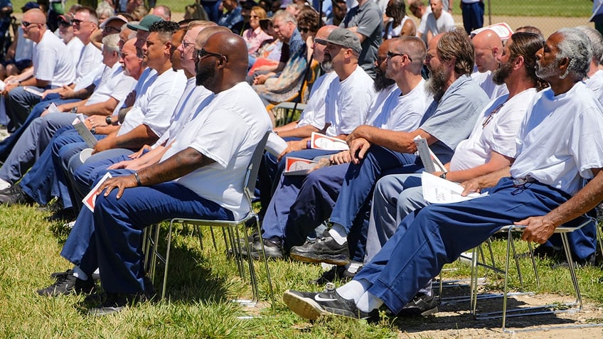 men watching a performance