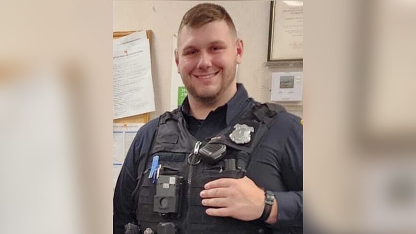 ohio police officer military veteran killed in line of duty ambush suspect at large report