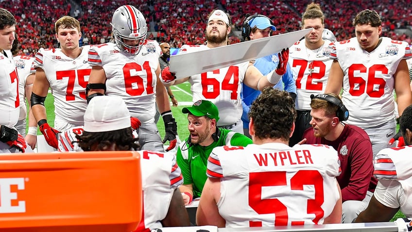 ohio state coach seeks more violent offensive line as season moves forward