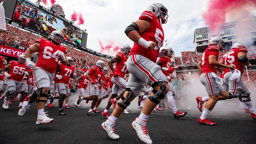 ohio state coach seeks more violent offensive line as season moves forward