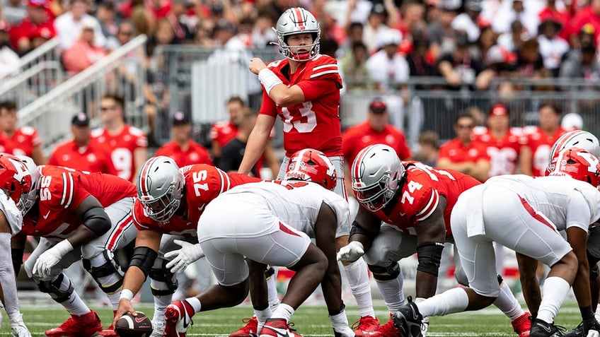 ohio state coach seeks more violent offensive line as season moves forward