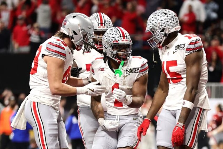 Quinshon Judkins of the Ohio State Buckeyes celebrates a touchdown during the team's victo