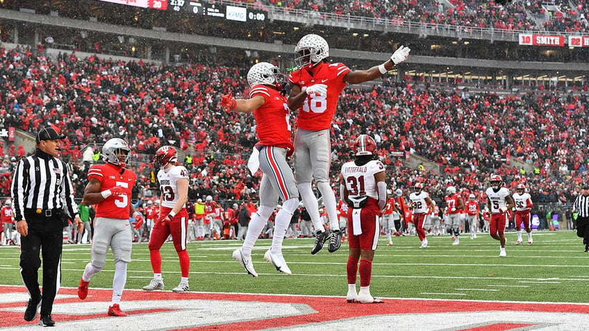 Marvin Harrison and Emeka Egbuka celebrate