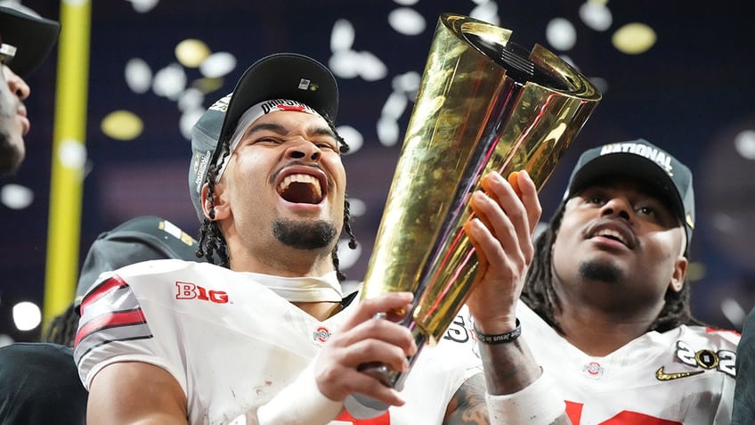 Emeka Egbuka with championship trophy