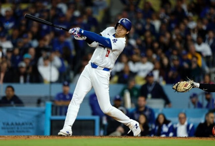 Shohei Ohtani crushes his first home run as a Los Angeles Dodger in a victory over the San