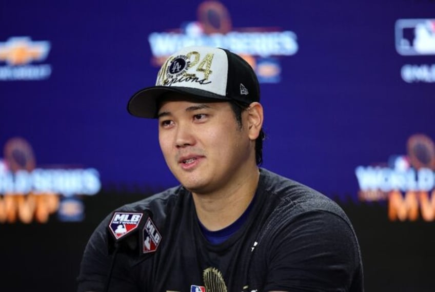 Los Angeles Dodgers star Shohei Ohtani talks to reporters after the team clinched the Worl