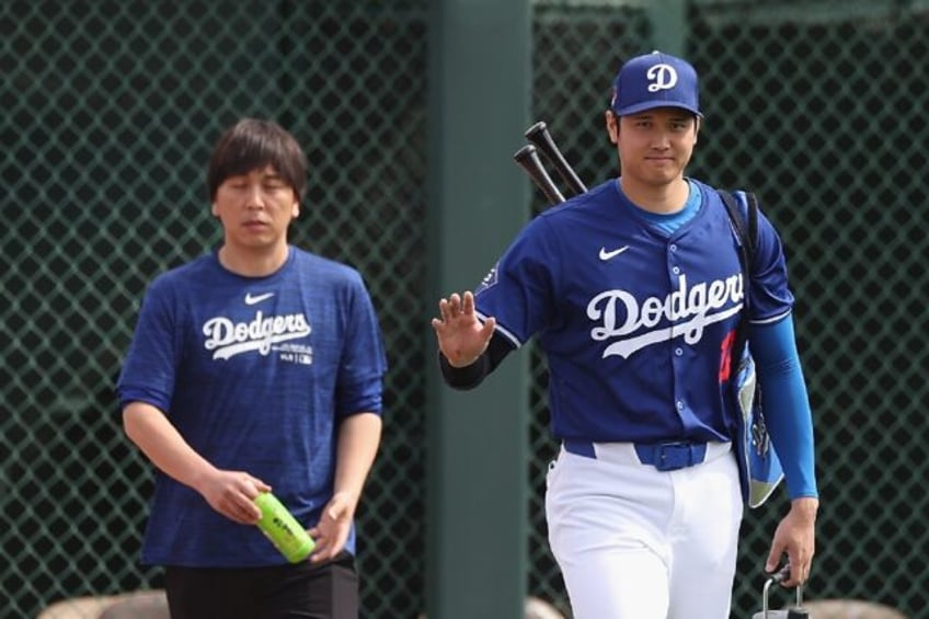 Interpreter Ippei Mizuhara (left) was released on bail on charges of stealing $16 million