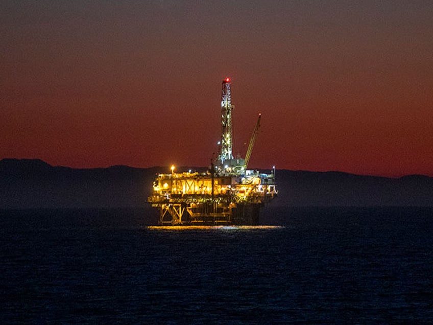 A view of oil platform Emmy off the coast of Huntington Beach at dusk Thursday, October 14