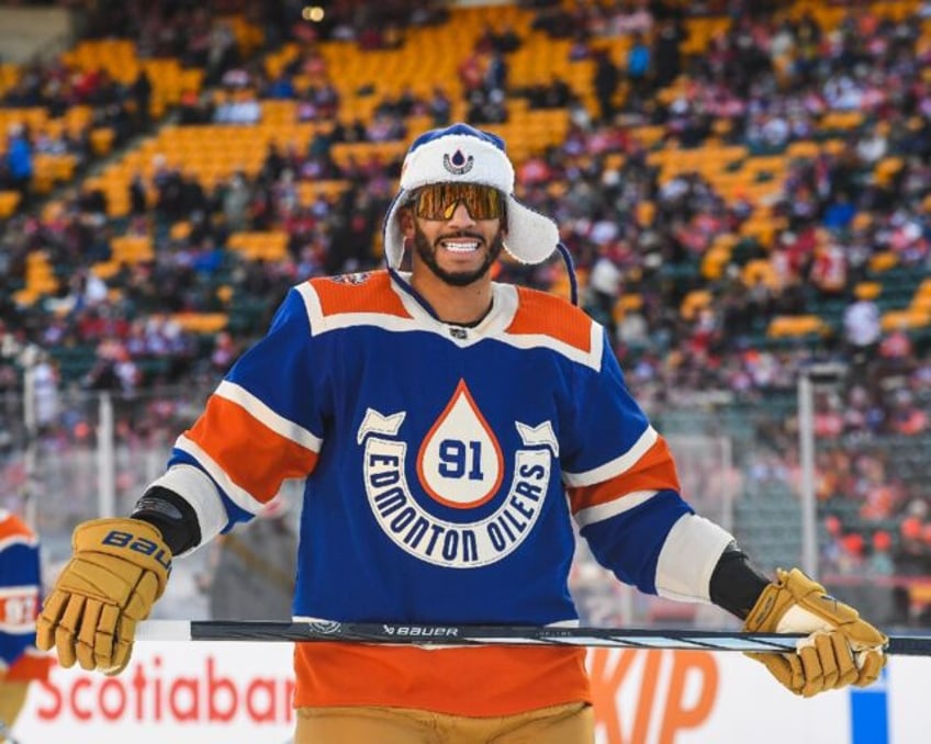 oilers defeat flames outdoors in nhl heritage classic