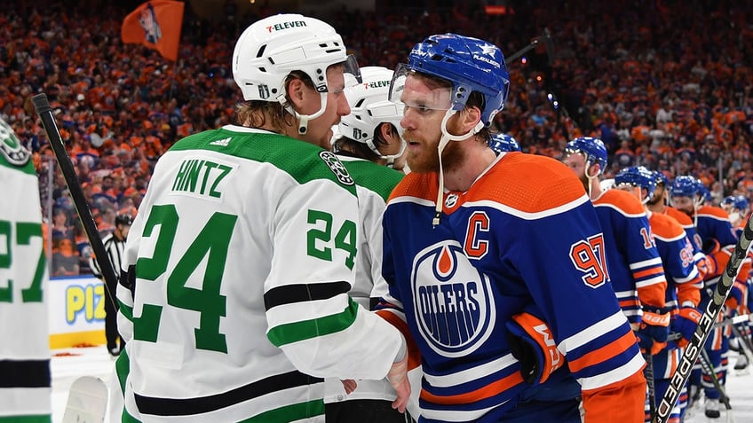 Connor McDavid shakes hands