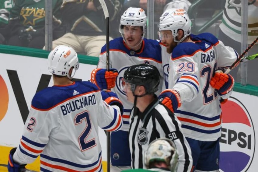Ryan Nugent-Hopkins of the Edmonton Oilers celebrates with teammates after scoring in the